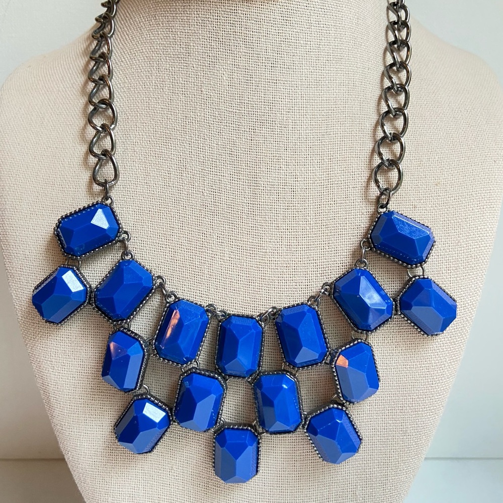Gunmetal tone statement necklace with faceted rectangular blue acrylic segments